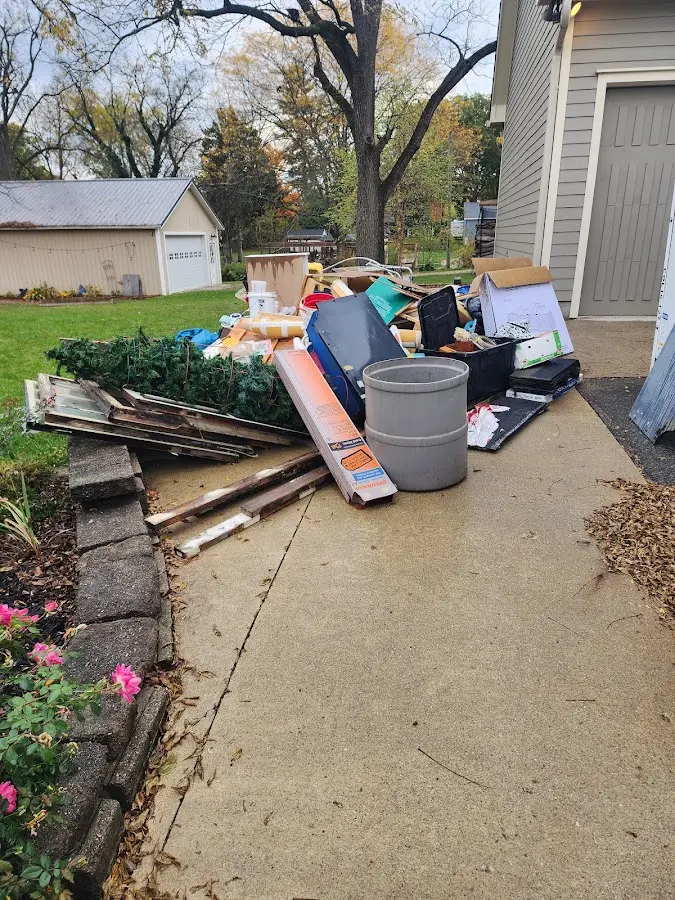 Dumpster being loaded with debris for Residential Dumpster Rental in Sedro-Woolley